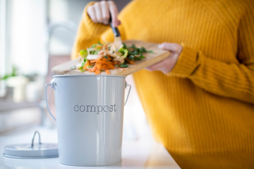 woman composting food scraps