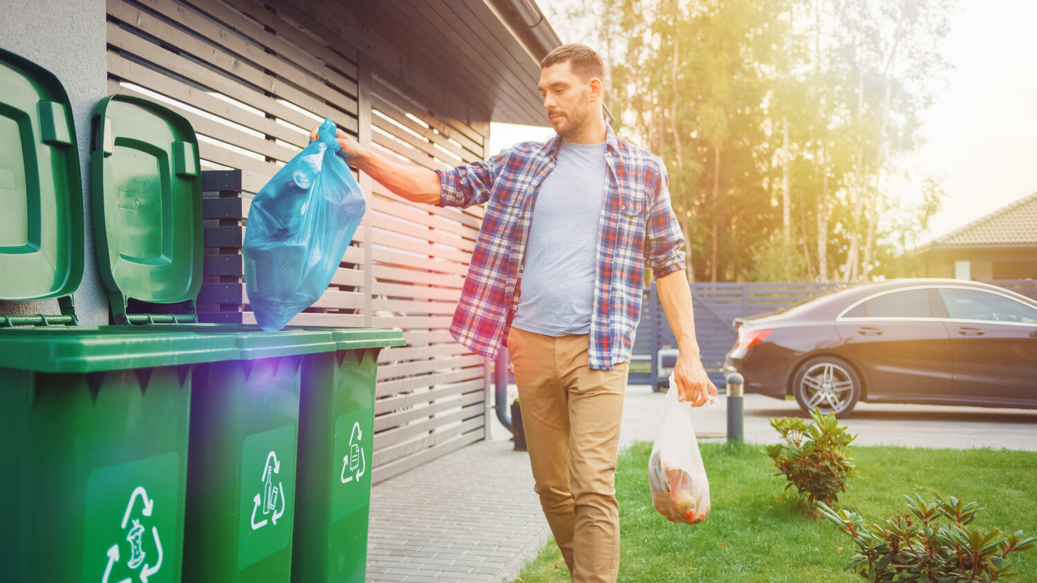 man using recycling bin