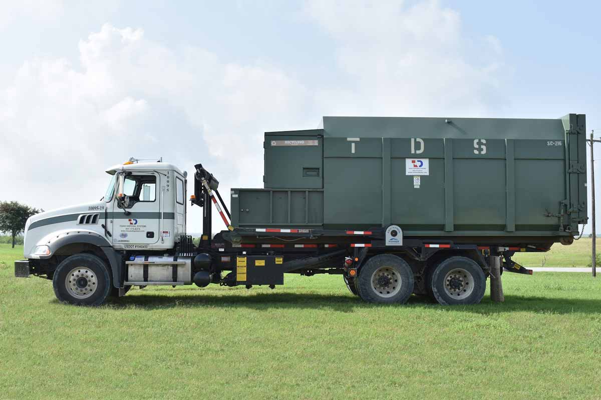 roll off compactor on TDS truck